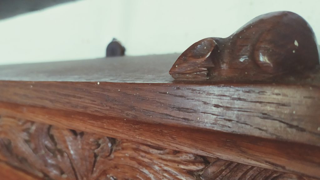 St James wooden church mouse hidden away on a carved piece of wood